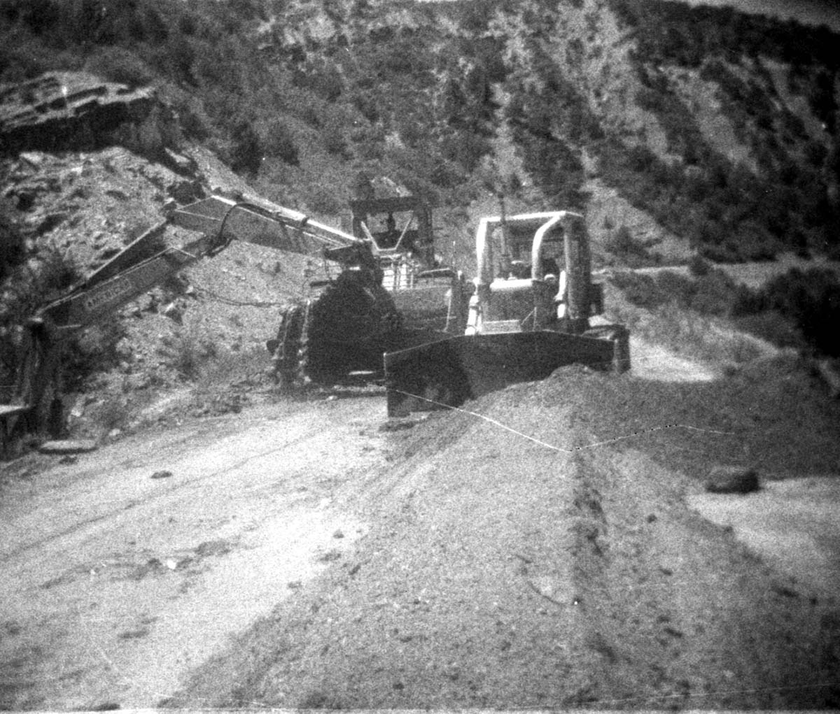 BW photos of rock slides in Kolob Canyons - 110mm. Heavy machinery clearing rock slide debris off roadway.