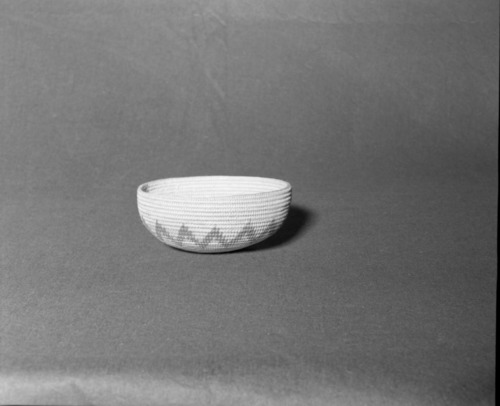 Mrs. Donald Segerstrom Collection. Object: Paiute basket. Dimensions: 7 1/4" x 3 1/4". Materials: split willow, dyed willow. Technology: three rod foundation, non-interlocking stitch, leftward coil direction, overstitched rim. Collection History: ---. Photographed by Michael Dixon. Catalogued by Craig Bates and Barbara Beroza. Yosemite Collections, National Park Service.