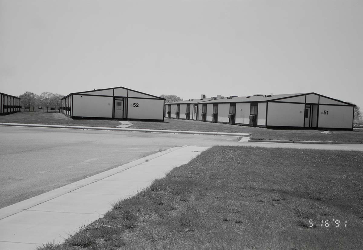Barracks and parking area. Building numbers 51 and 52. [Image possibly for comparative housing study]