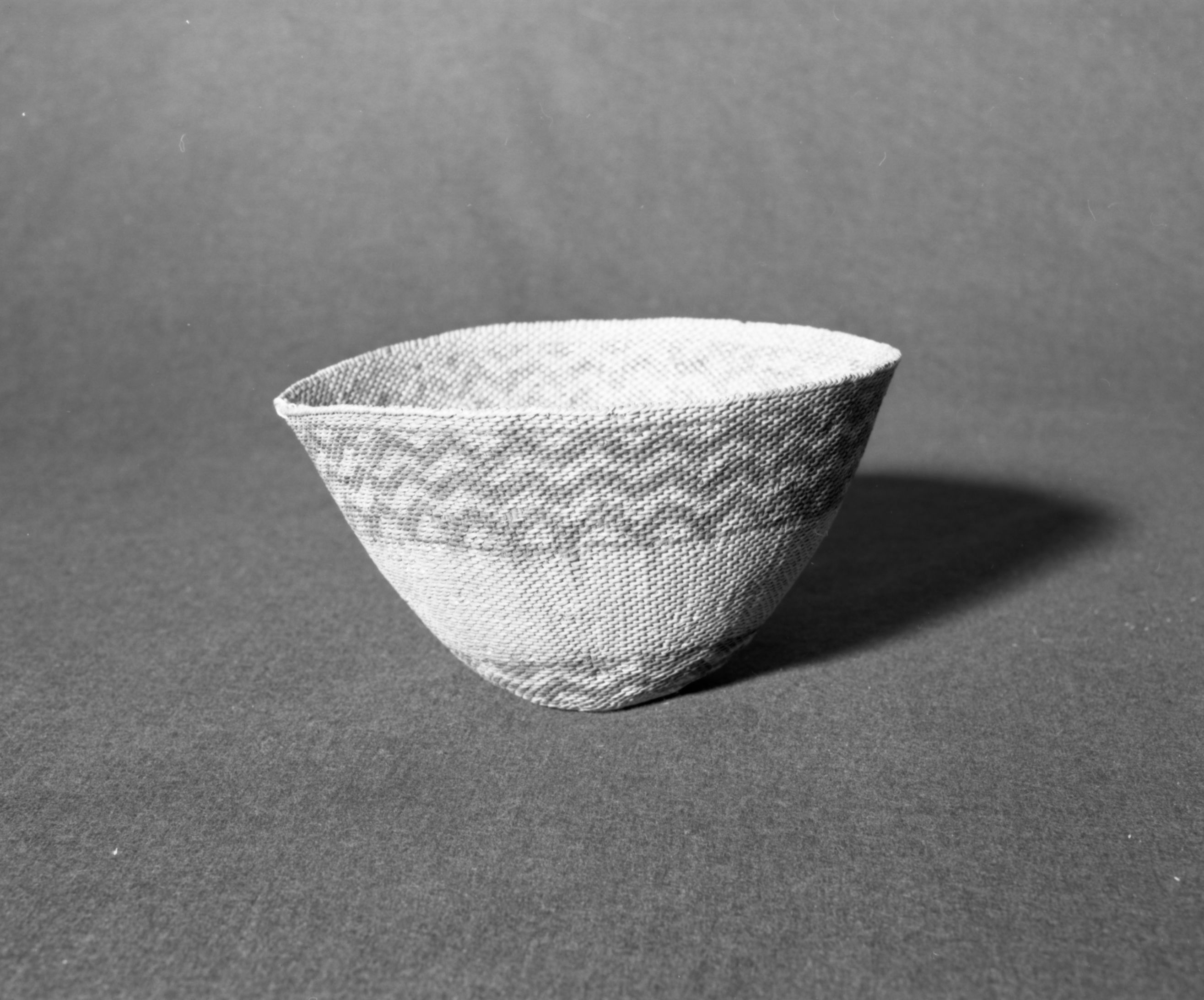 Marie Rozier Collection, Catalog No. 16. Object: Paiute hat. Dimensions: 8 1/2 x 6". Materials: willow, ephedra and yellow ochre dye. Technology: diagonally twined, up to right slant of turns. Collection History: Alice Reade collection. Photographed by Michael Dixon, December 1982. Catalogued by Craig Bates and Barbara Beroza. Yosemite Collections, National Park Service.