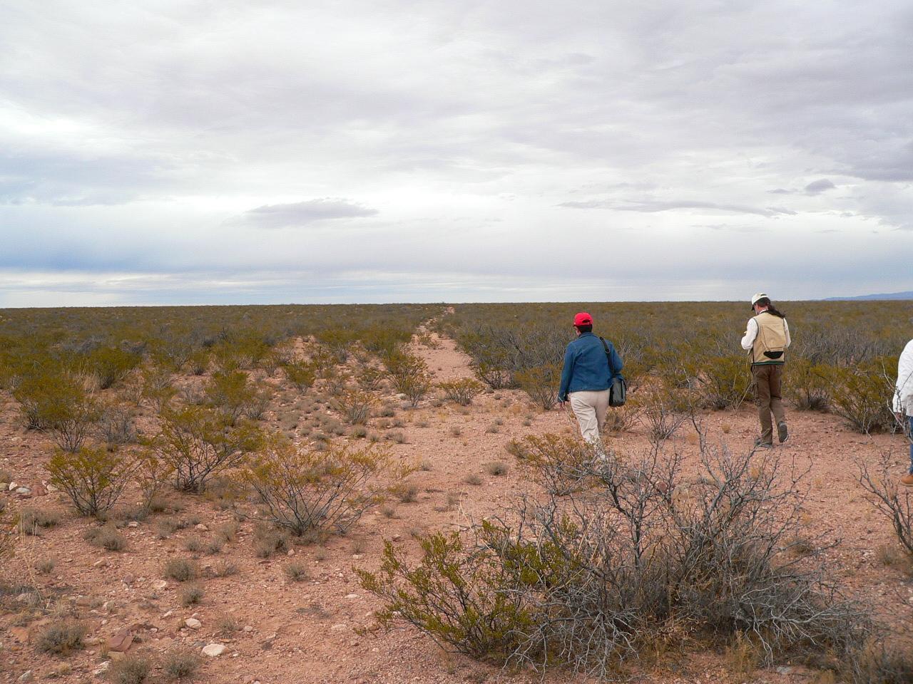 A couple walks North on the Yost Draw in Sierra County, NM