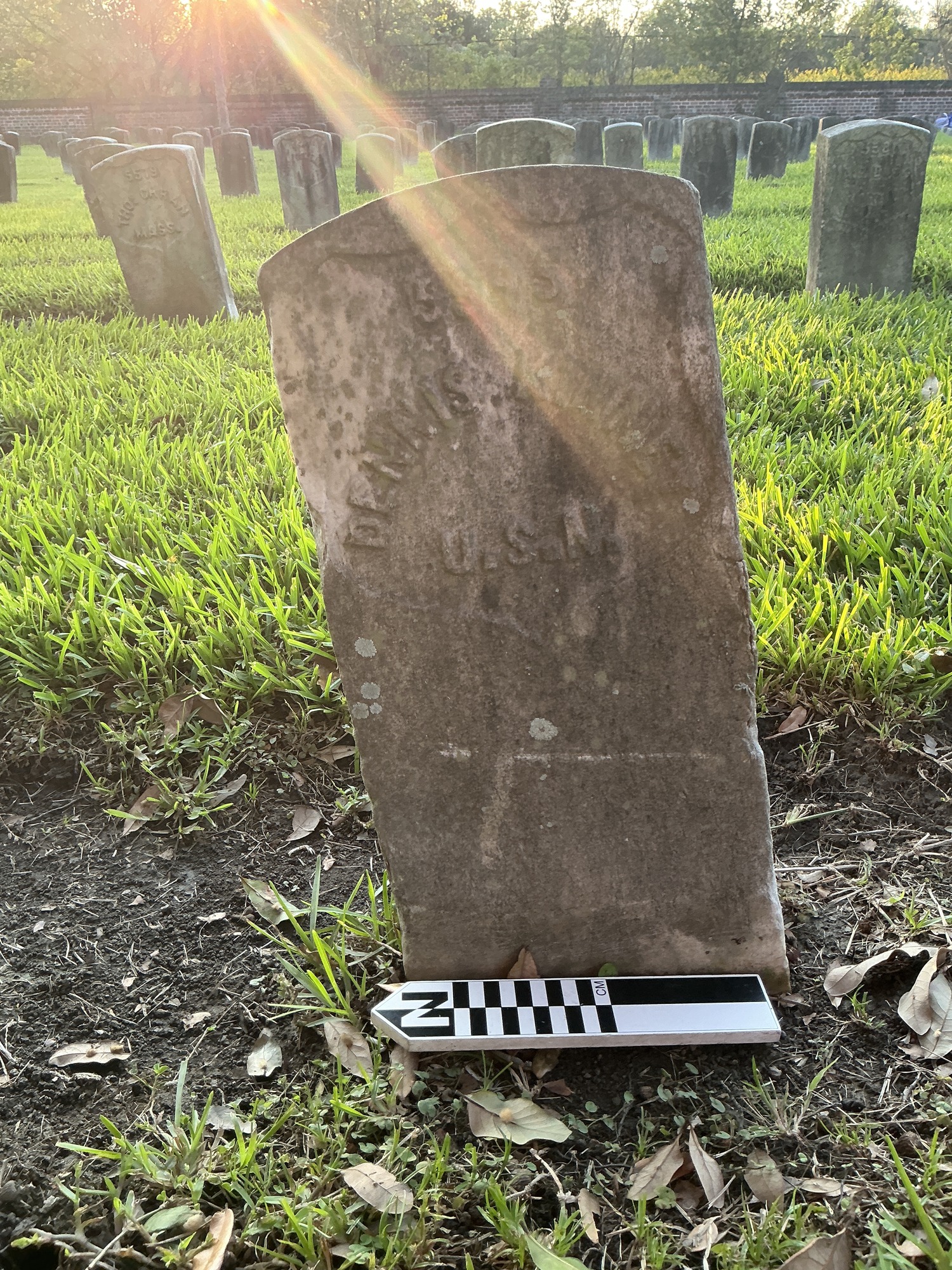 Extra image of historic upright marble headstone with recessed shield face.