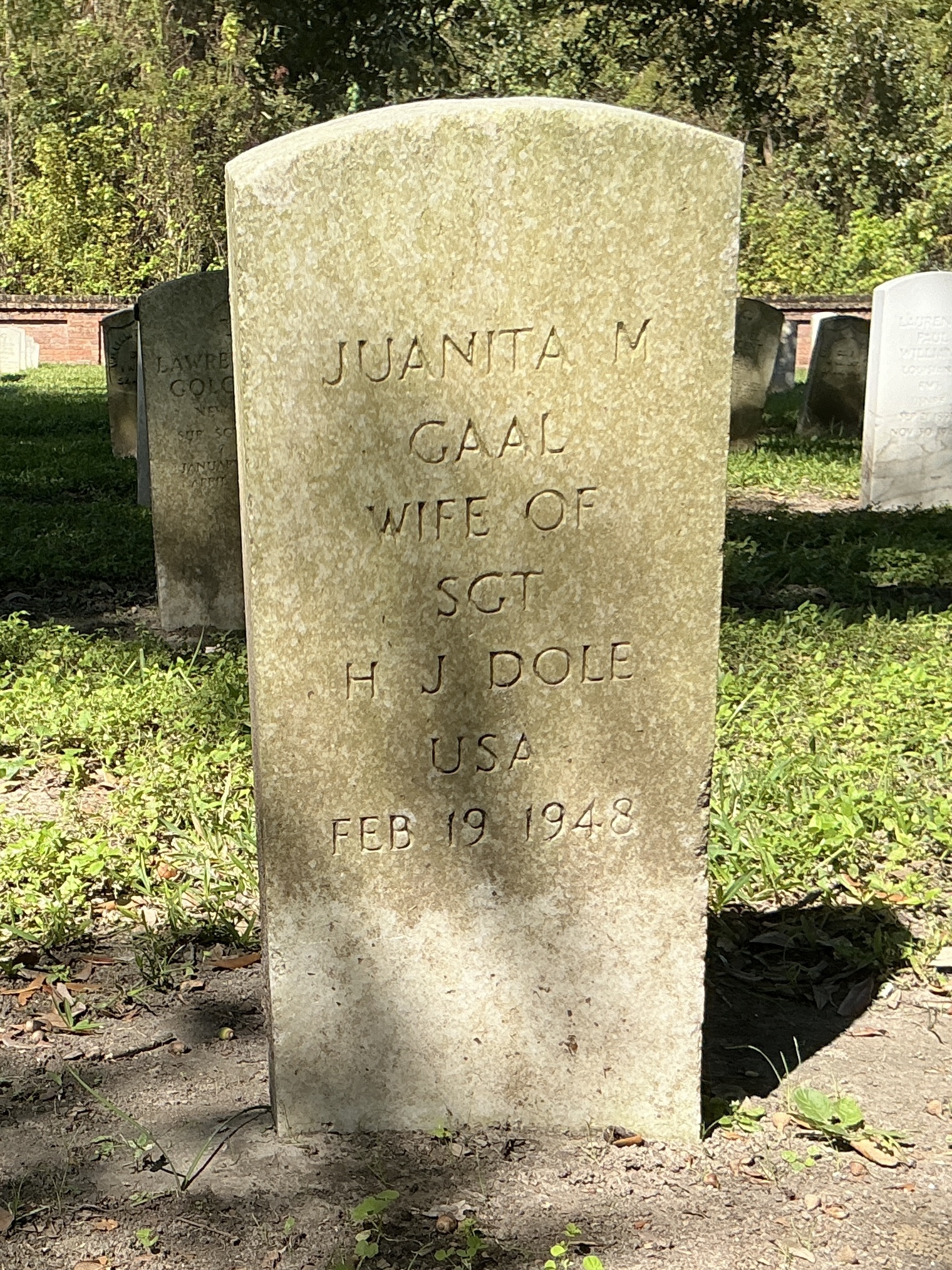 Front of historic upright marble headstone with flat face.
