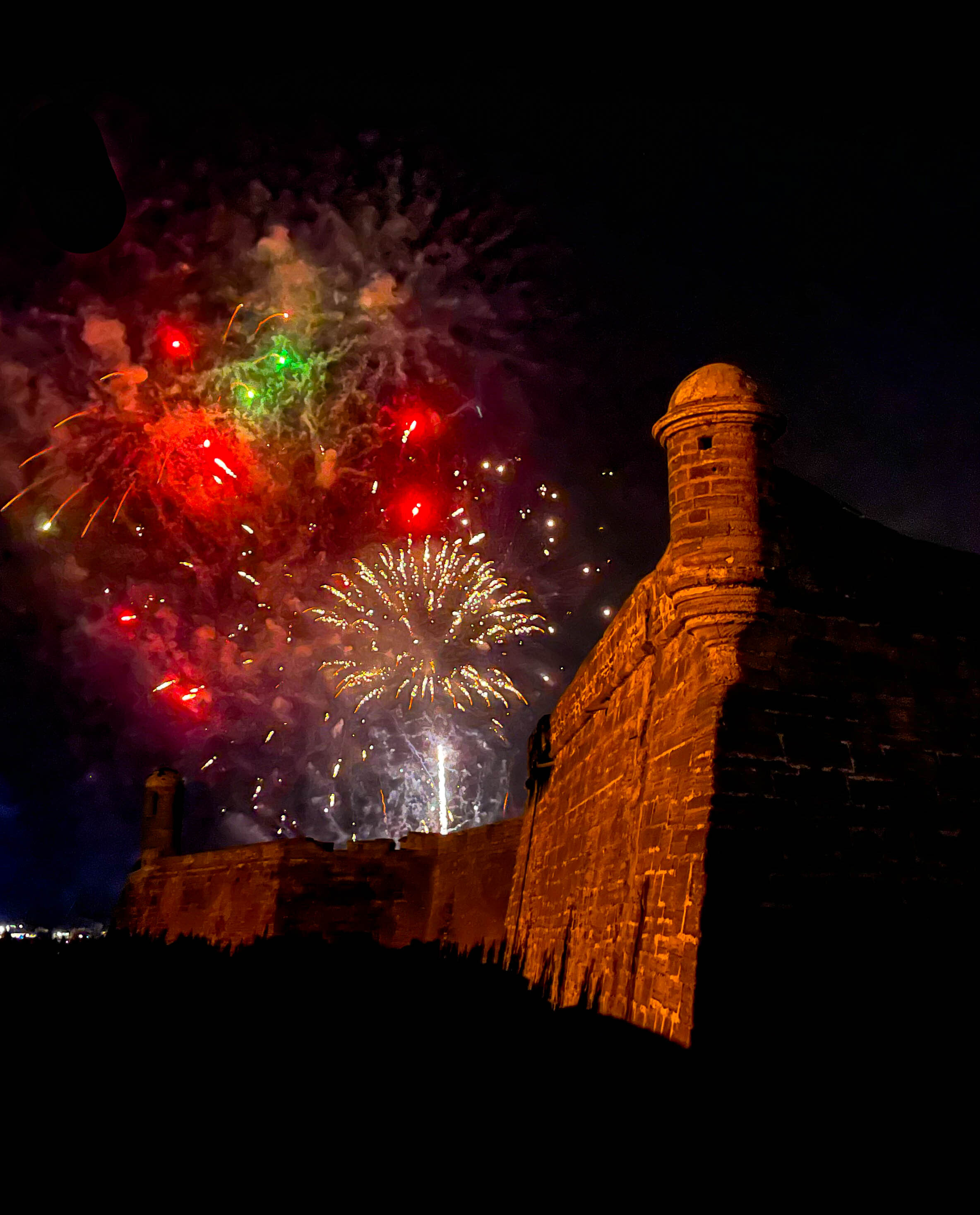 Colorful fireworks over a colonial Spanish fort 