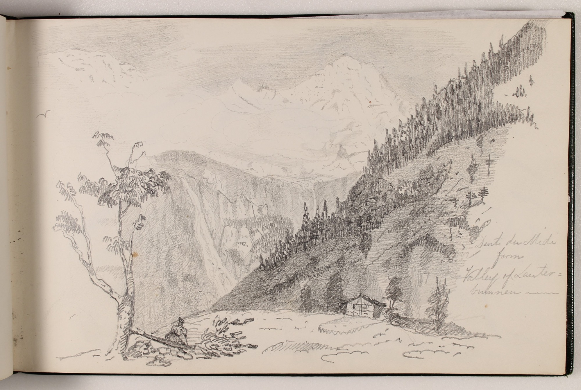 Pencil landscape in sketchbook of a pass between tall mountains.