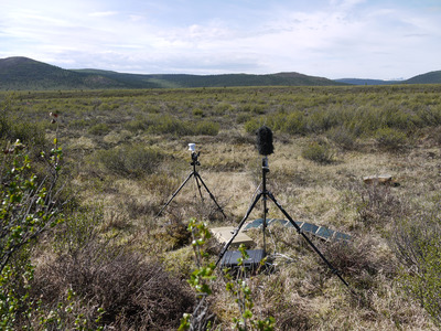 scientific equipment in a tree-less tundra landscape