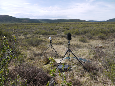 scientific equipment in a tree-less tundra landscape