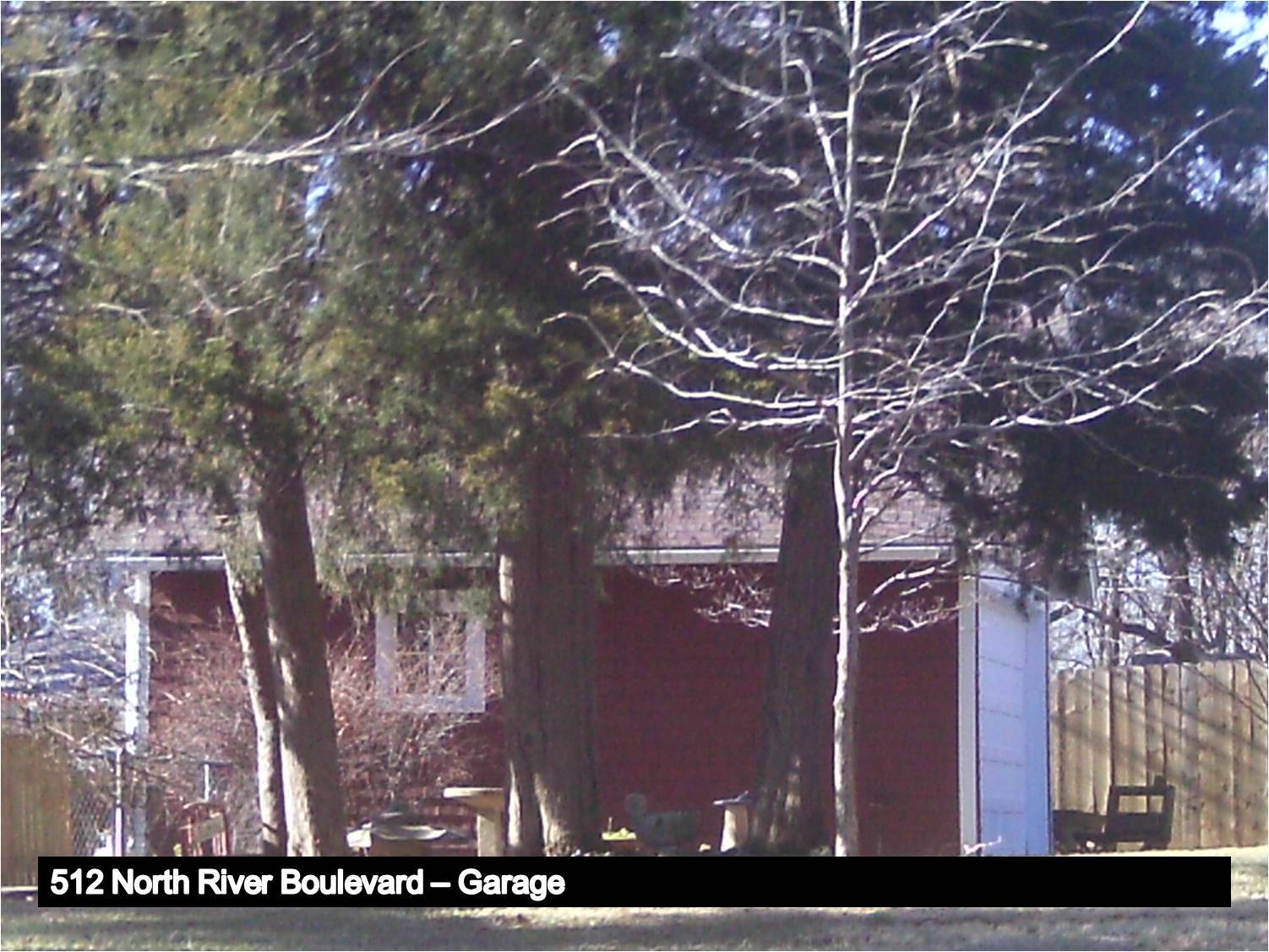 Image of a garage with a gabled roof.
