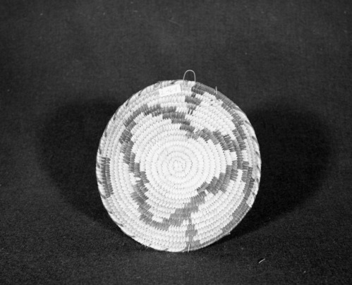 Marie Rozier Collection, Catalog No. 164. Object: Papago basket. Dimensions: 8 x 2 1/2". Materials: yucca, devil's cloth. Technology: snake design. Collection History: Purchased at Mt. View rummage sale. Photographed by Michael Dixon, Dec. 1982. Catalogued by Craig Bates and Barbara Beroza. Yosemite Collections, National Park Service.