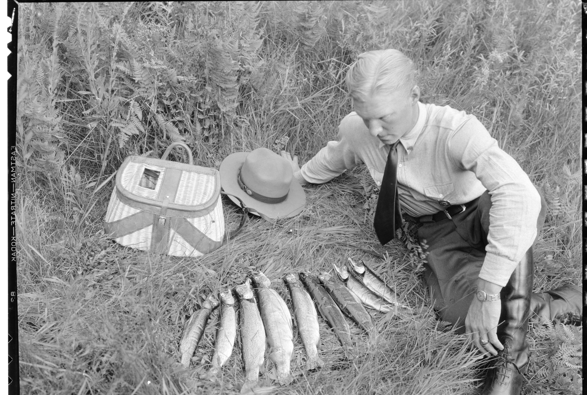Ranger Frank Givens and string of fish