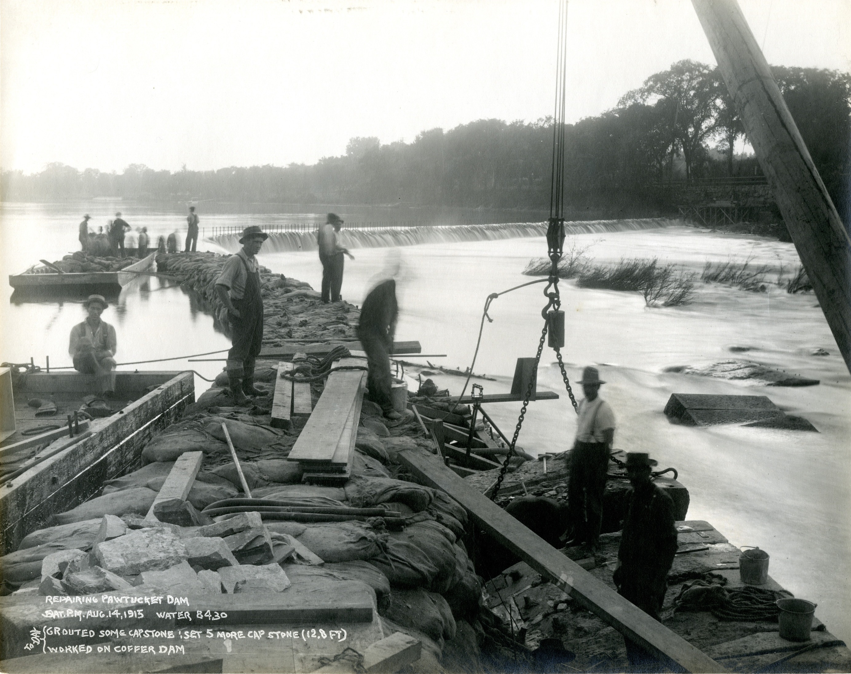 A photo showing workers on the dam