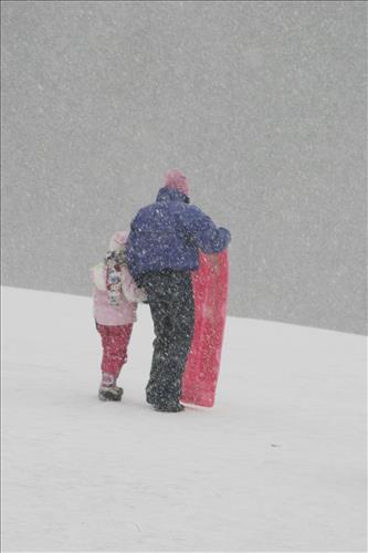Sledding at Kendall Hills Adult and Child