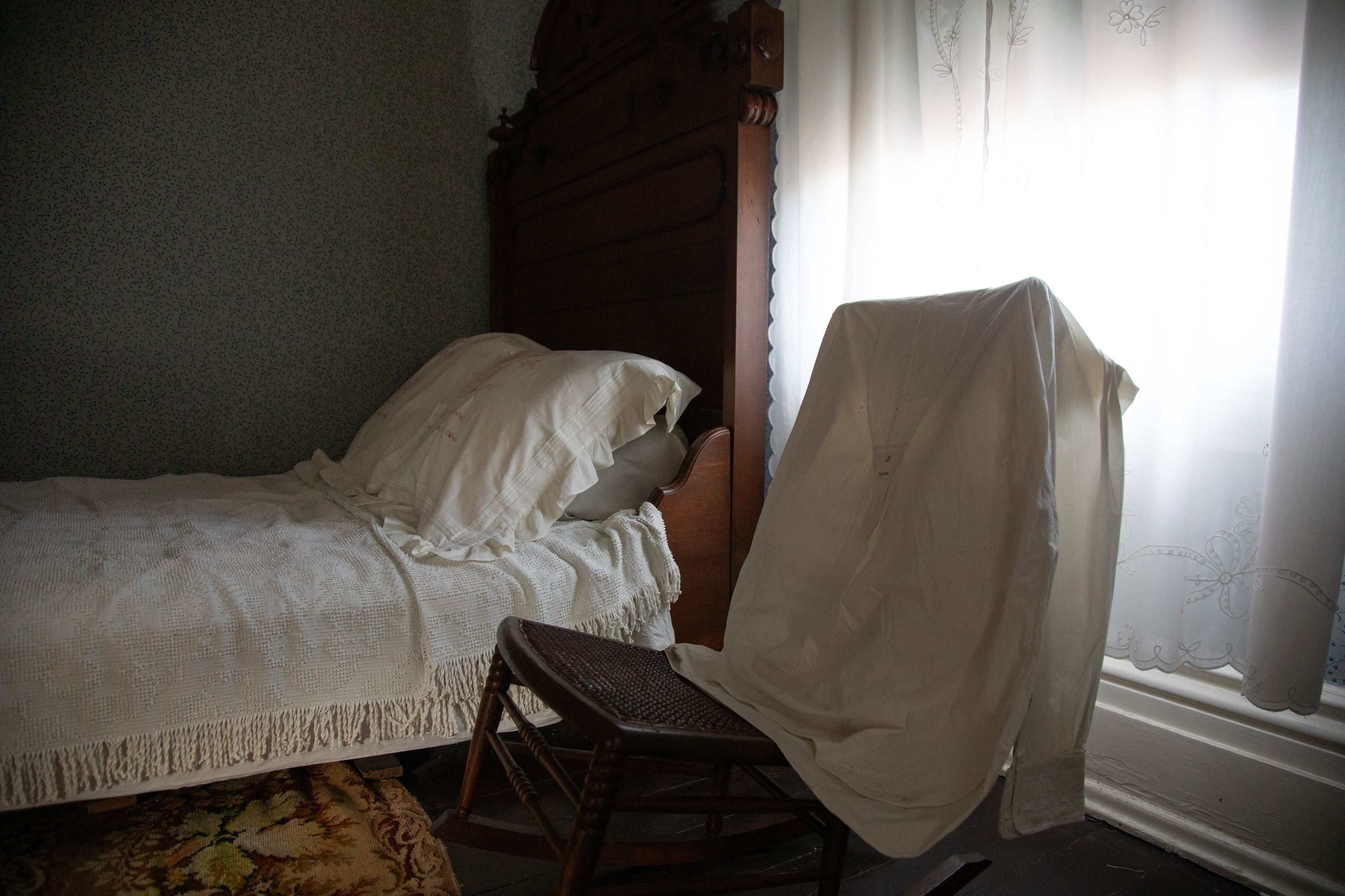 A shirt over a chair in a bedroom