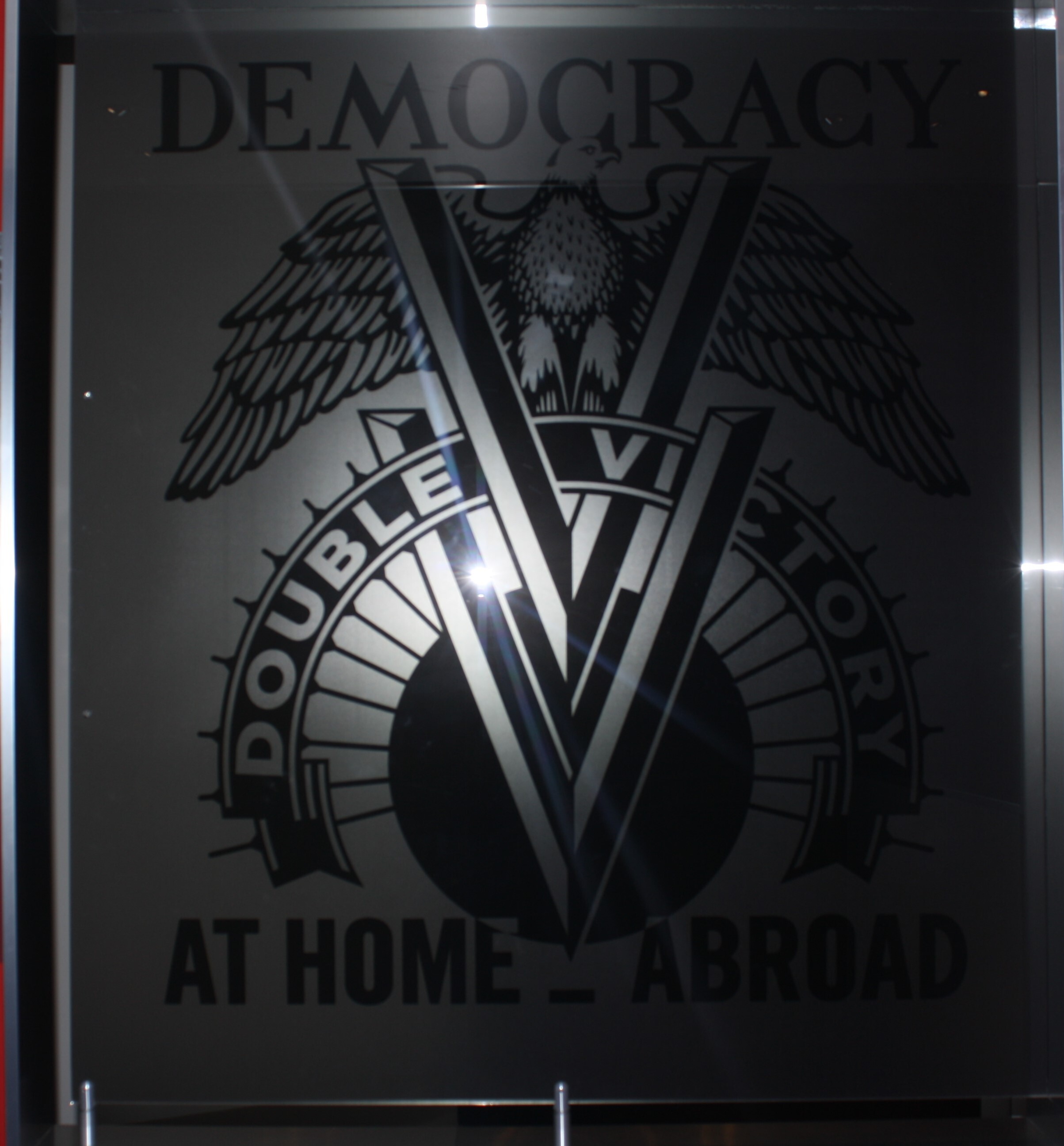 Two V's with bird on top
