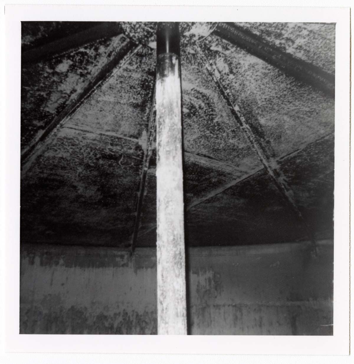 The interior of the 40000 gallon water tank showing buildup/corrosion.