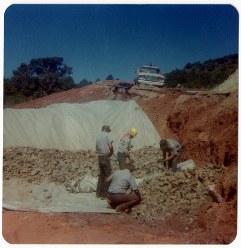 Men organizing rocks/debris in order to complete road work in Kolob Canyon.