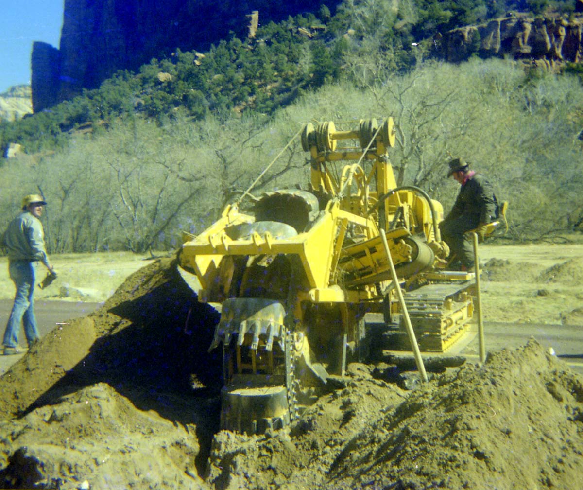 Construction vehicles and workers during the Zion Lodge utilities project.