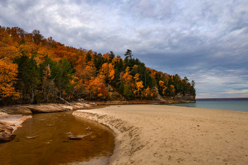 A rock shelf extending into Lake Superior on an autumn day. 