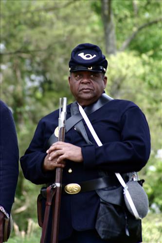 Portaits of Civil War interpreters of U.S. Colored Troops with their rifles at Stones River National Battlefield, April 2004