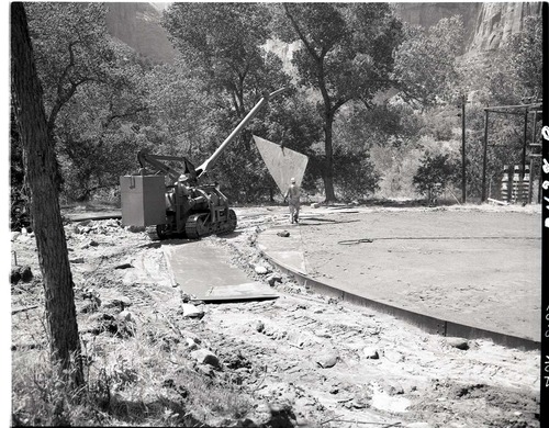 Construction of million gallon water tank at Birch Creek. Contractors are laying steel plates for floor, half the plates in place water distribution structures.