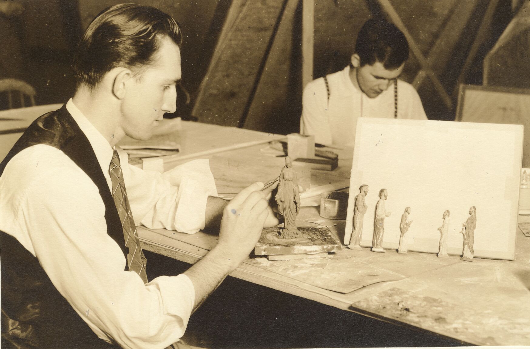 historic photo of artists at work, sculpting