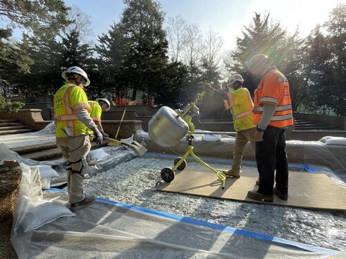 Mixing concrete aggregate for a horizontal surface along the cascade fountain at Meridian Hill Park.