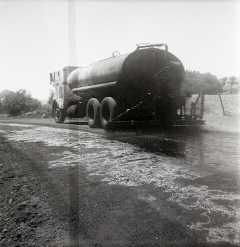View from behind of construction vehicle during chipsealing of Kolob Canyon Road.