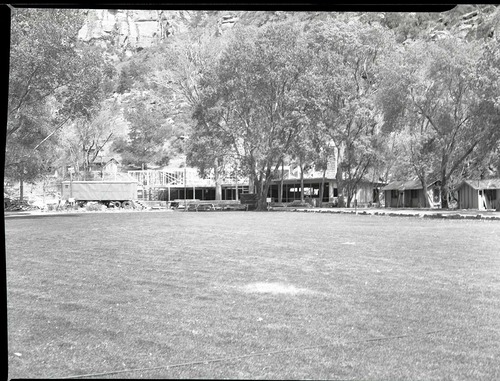 Rebuilding Zion Lodge after fire of January 28, 1966 - walls and ceilings of much of lodge in place.