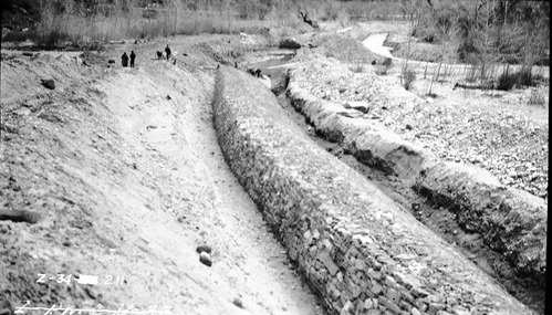 Soil and moisture control along Virgin River with the construction of basket dam.