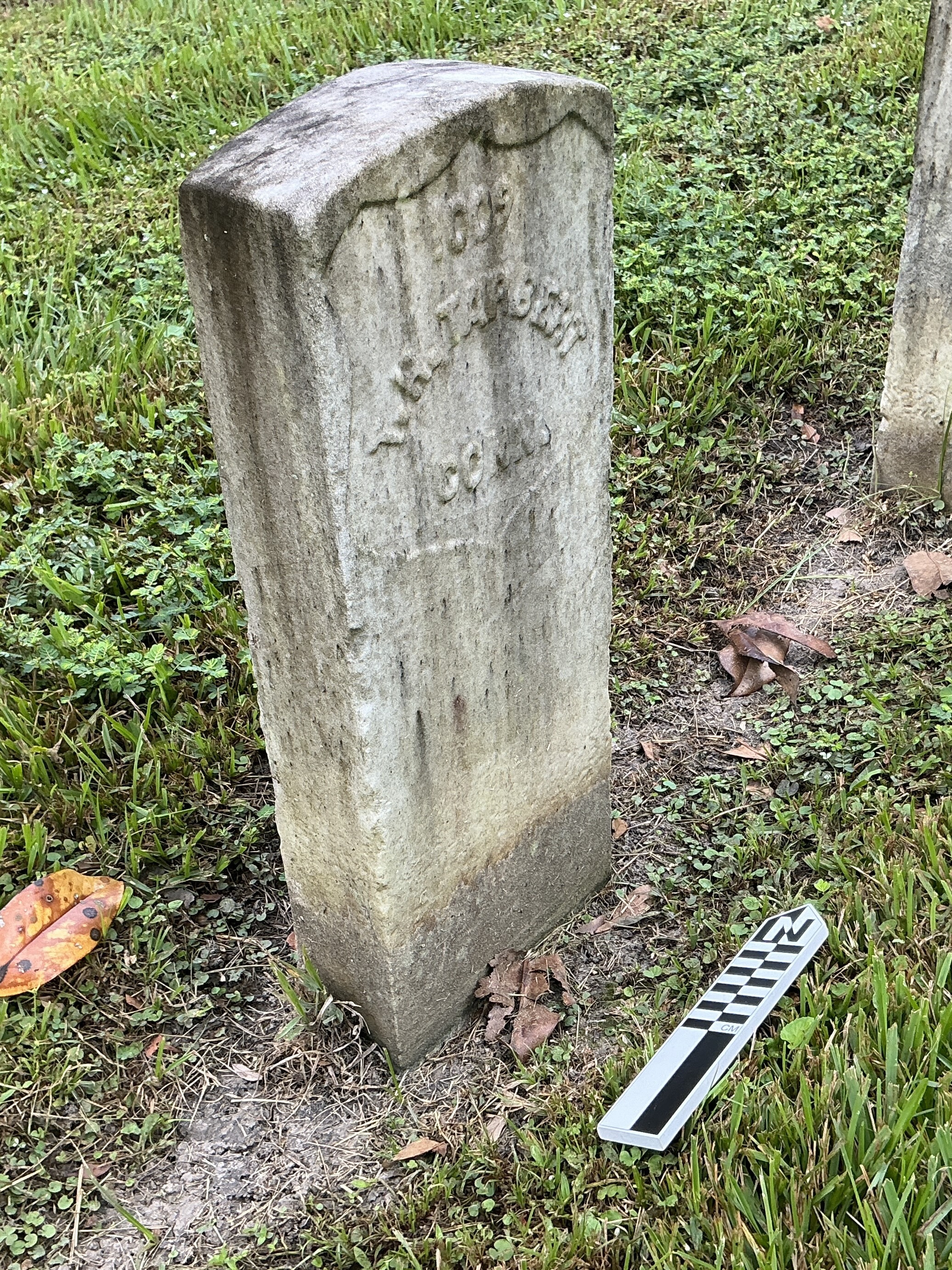 Extra image of historic upright marble headstone with recessed shield face.