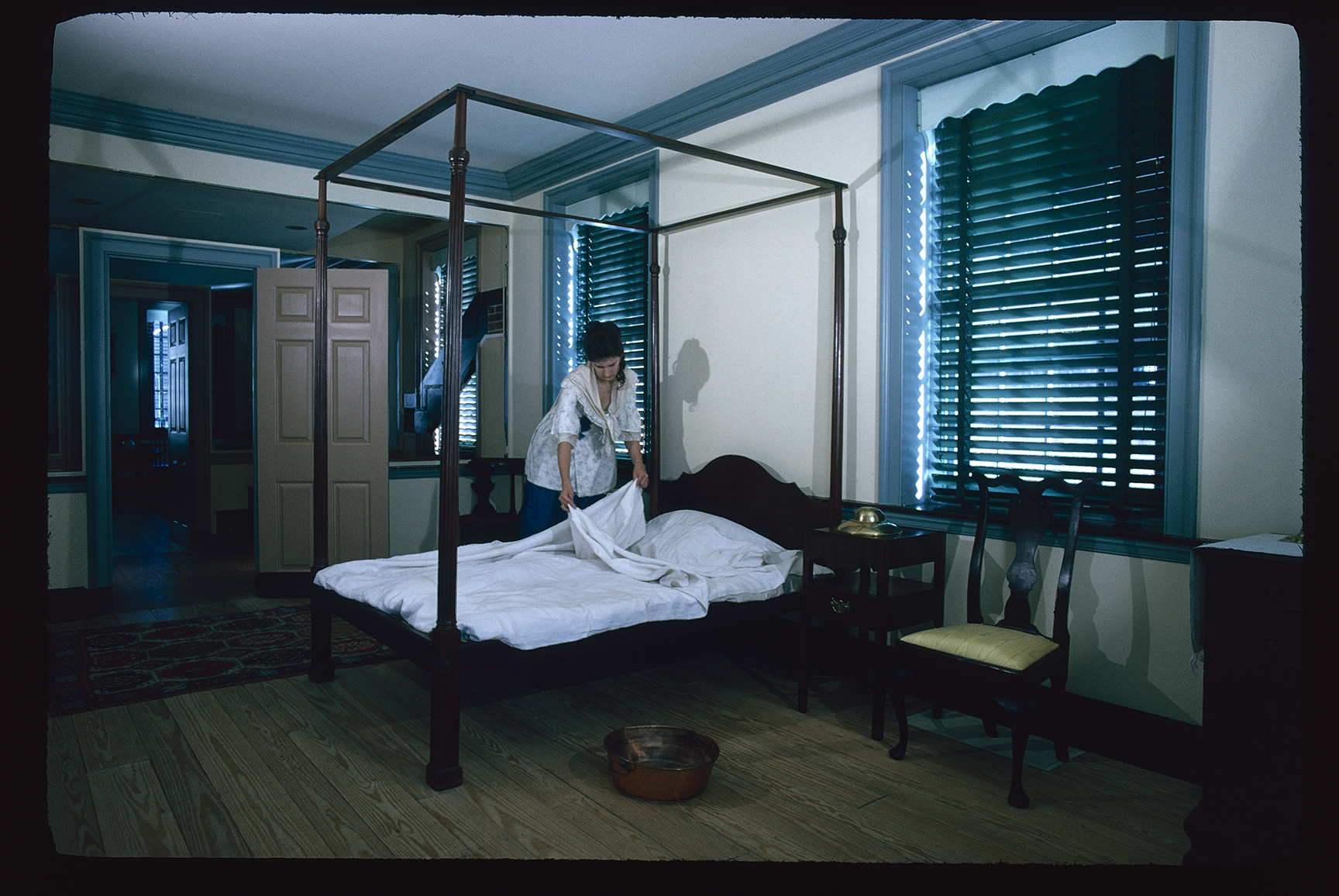Graff (Declaration) House. Interior. 2nd floor, Thomas Jefferson's bedroom. Looking northeast. Reenactor preparing bed.