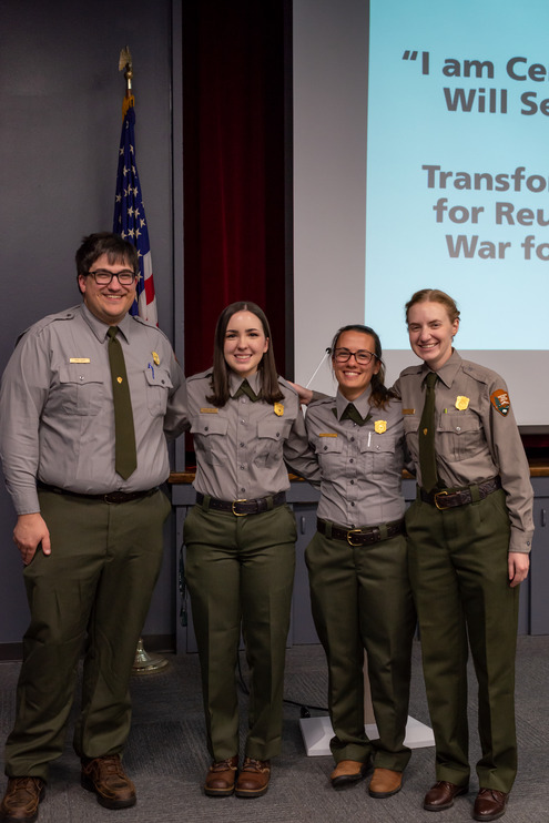 Four park rangers pose for a picture.