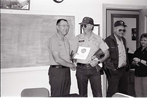 BW Photos of Superintendent Harold Grafe giving out awards to park personnel.