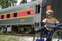 Cuyahoga Valley Scenic Railroad, Bikers Waiting to Board Train. In 2007 CVSR and NPS launched Bike Aboard!service to encourage use of the railroad as alternative transportation. For a $2 fare cyclists can ride the train in one direction and bike the other along the Ohio & Erie Canal Towpath Trail. Some images are at Rockside Station and others in Peninsula near the Peninsula Depot.