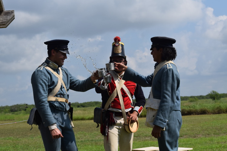 Living history volunteers celebrate with a nice cup of water