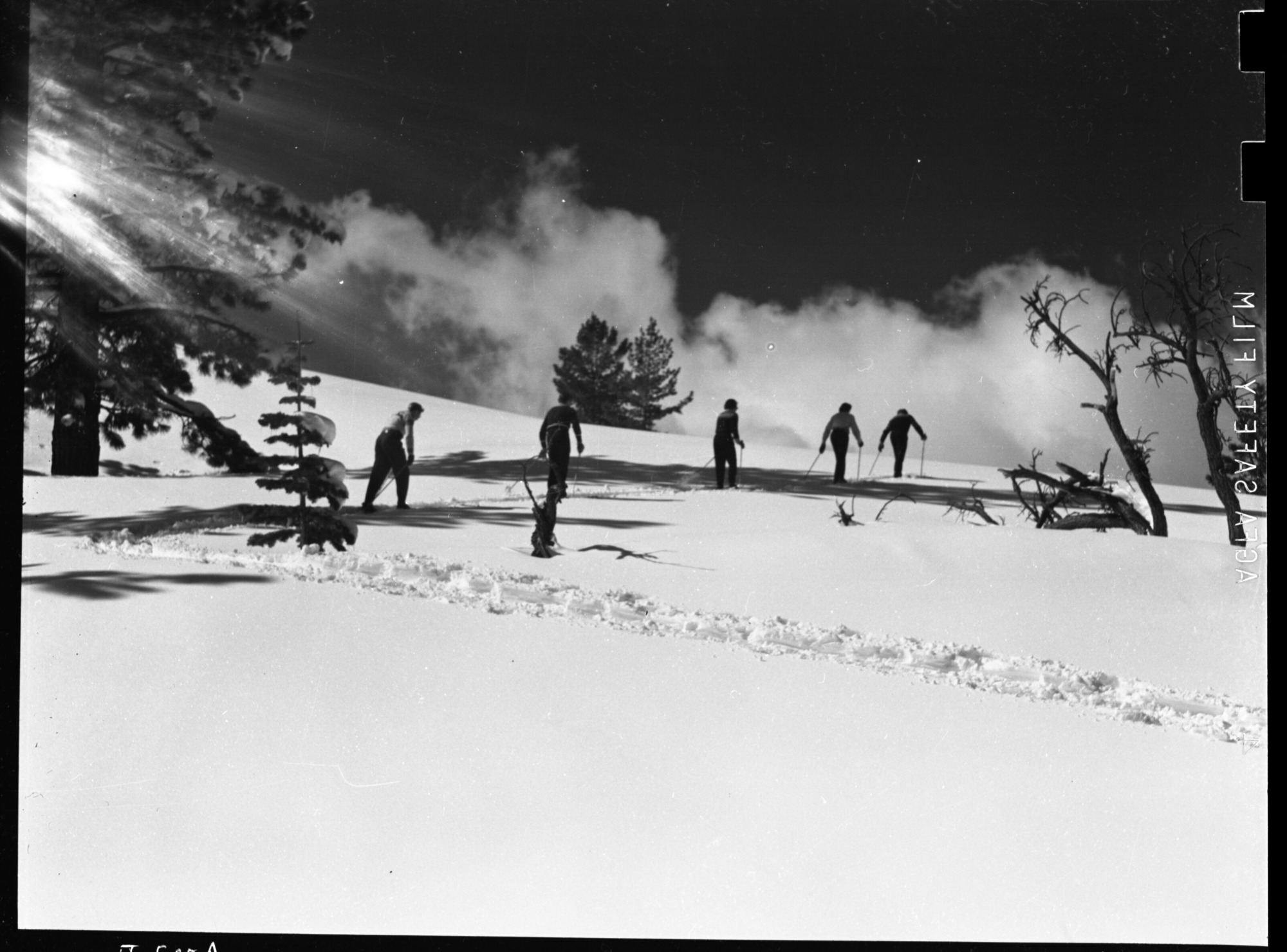 Jack Kuhne packing heavy camera on snowshoes