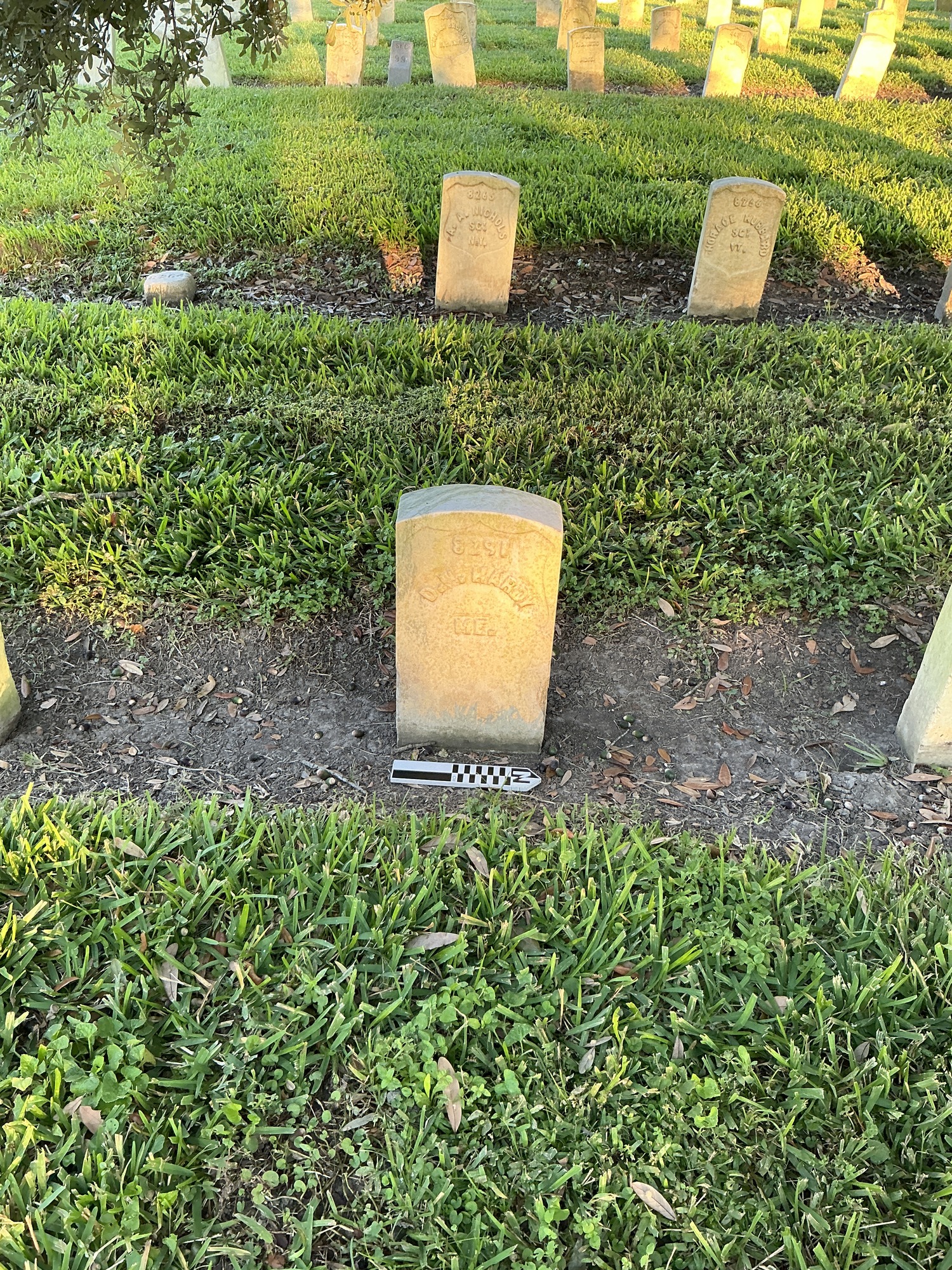 Extra image of historic upright marble headstone with recessed shield face.