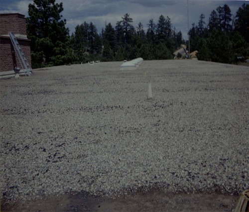 New layer of gravel spread during reroofing project. Bryce Canyon National Park.