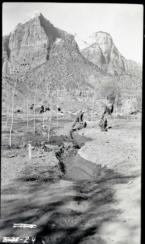 Irrigation system and laborers digging ditch in South Campground.