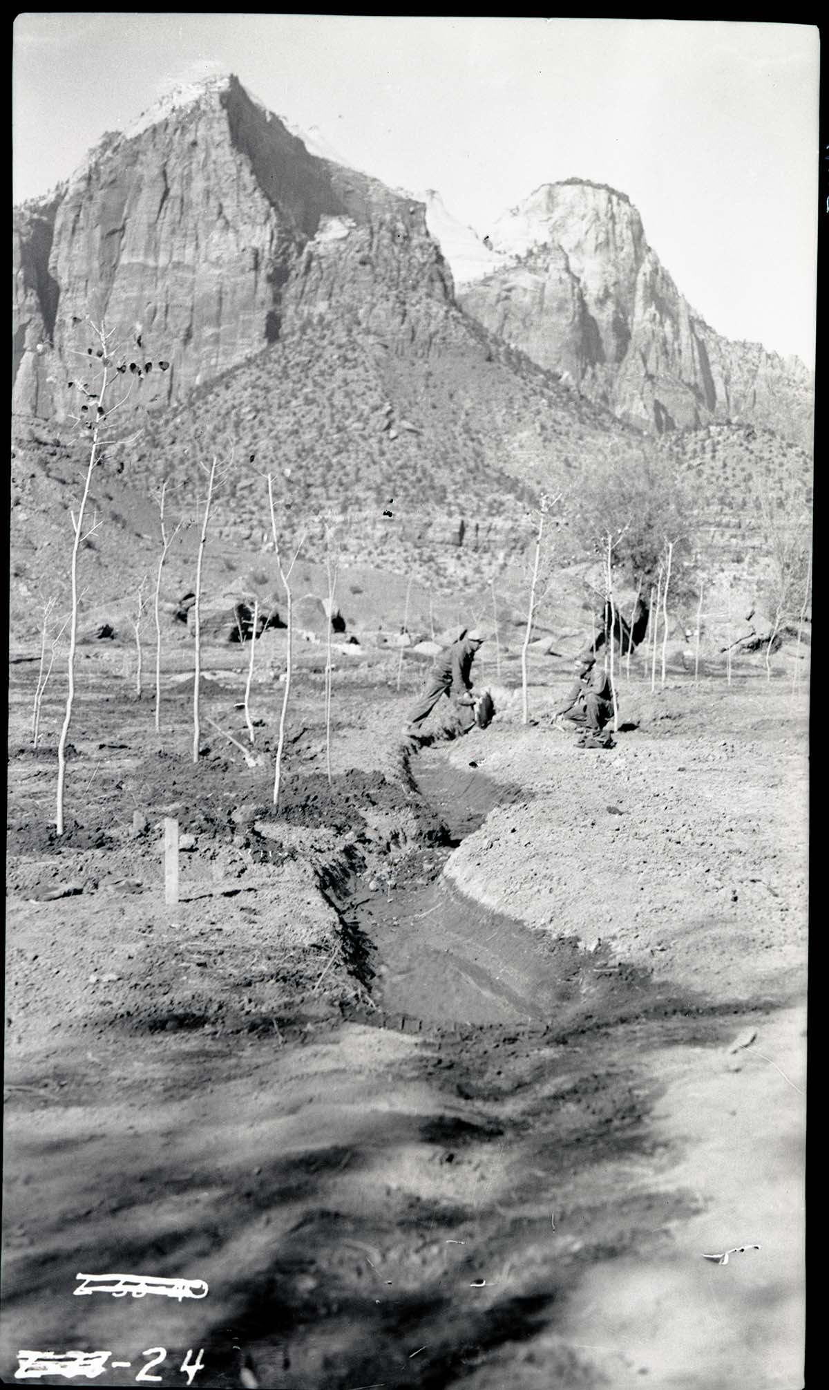 Irrigation system and laborers digging ditch in South Campground.