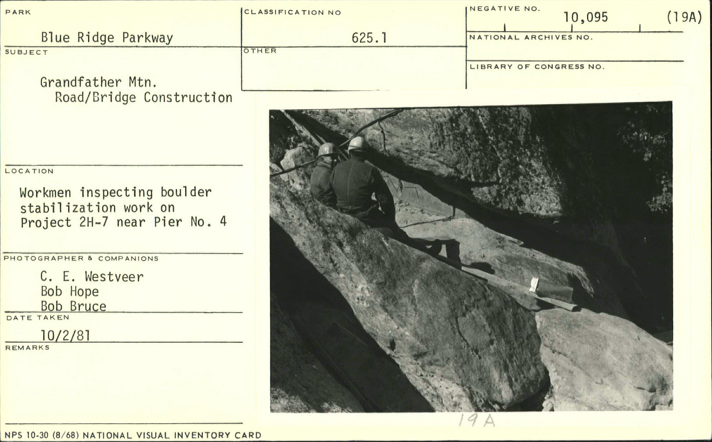 Workmen inspecting boulder stabilization work near Pier No. 4