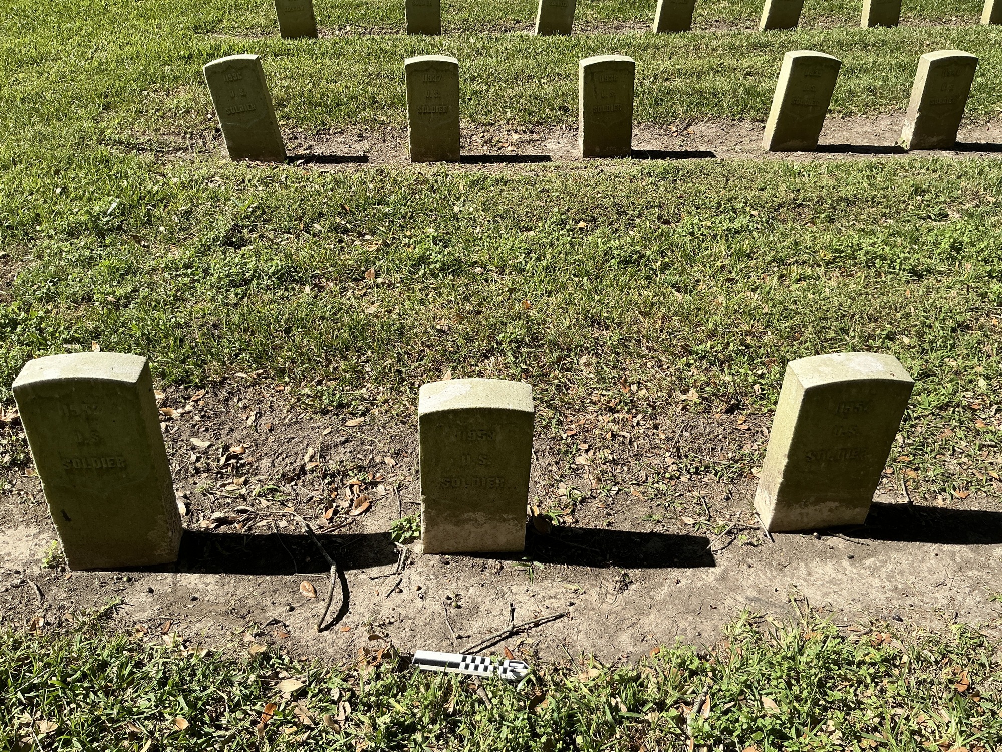 Extra image of historic upright marble headstone with recessed shield face.
