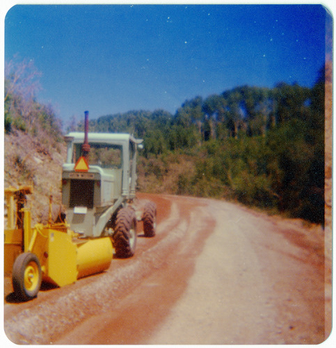 Construction vehicle performing road work along the Kolob Terrace Road.