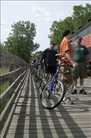 Cuyahoga Valley Scenic Railroad, Bikers Waiting to Board Train. In 2007 CVSR and NPS launched Bike Aboard!service to encourage use of the railroad as alternative transportation. For a $2 fare cyclists can ride the train in one direction and bike the other along the Ohio & Erie Canal Towpath Trail. Some images are at Rockside Station and others in Peninsula near the Peninsula Depot.