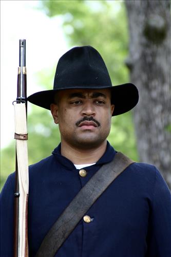 Portaits of Civil War interpreters of U.S. Colored Troops with their rifles at Stones River National Battlefield, April 2004