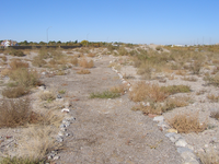 A dirt road in the desert.