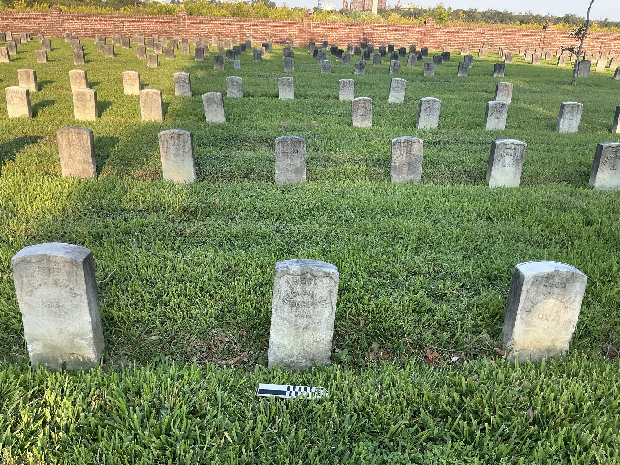 Extra image of historic upright marble headstone with recessed shield face.
