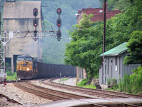 train passing old buildings
