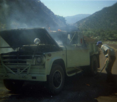 Color photo of an engine fire in a pickup.