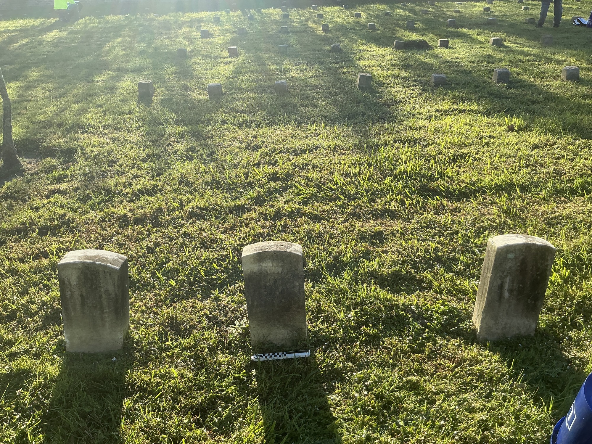 Extra image of historic upright marble headstone with recessed shield face.